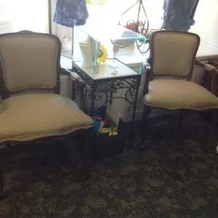 Seating area with a basket of toys to entertain your kiddos while you shop