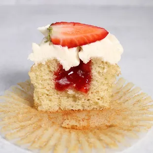 Victoria Sponge - Vanilla sponge filled with homemade strawberry jam topped with vanilla buttercream and a strawberry.
