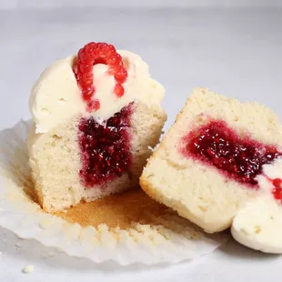 Berry White - Vanilla sponge filled with homemade raspberry jam topped with white chocolate buttercream and a raspberry.