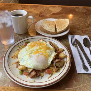 Veggie skillet eggs over easy Monterey Jack cheese redskin potatoes rye toast and coffee.Sooooooo Goooood !!