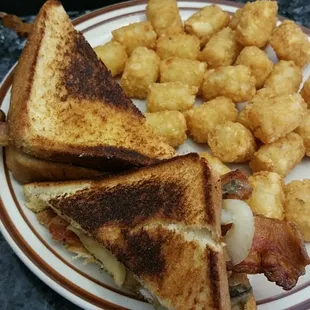 Grilled chicken sandwich and tater tots
