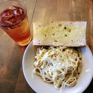 a plate of pasta and bread