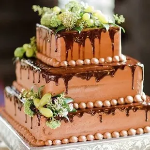 a three - tiered chocolate cake