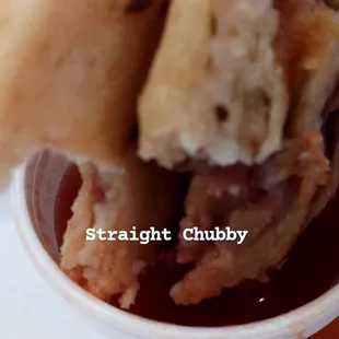 a hand holding a sandwich