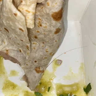 a burrito with sauce
