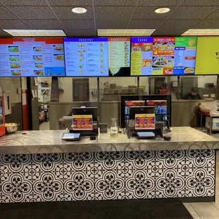 a restaurant counter and menus