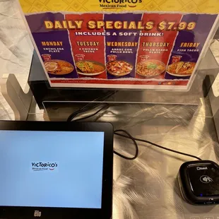 a tablet with a menu on it