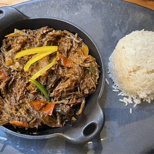 Ropa Vieja (hanger steak with peppers) and white rice (which also comes with a bowl of black bean sauce for the table)