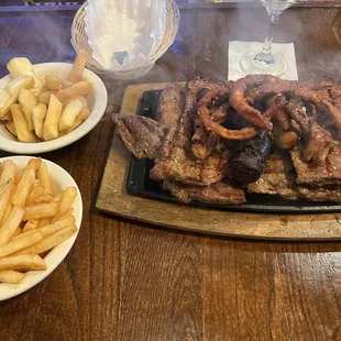 Parrillada Argentina with fries and yuca