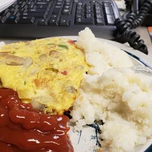 Take-out from Victor&apos;s Kitchen on Park Blvd and 56th Street, veggie omelette and grits, yummy for my tummy