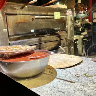 Pizza making window at entrance.