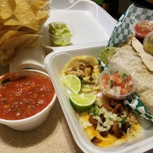 So good.  L to R... salsa, chips, side of guacamole, carnea asada burrito, side of pico de gallo, adobada and chicken taco.