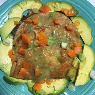 an avocado with meat and vegetables