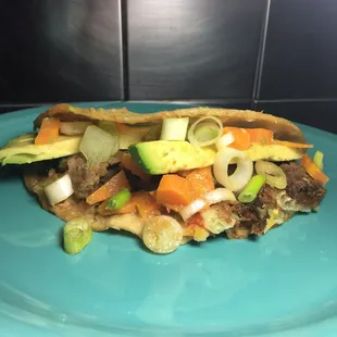 a taco on a blue plate