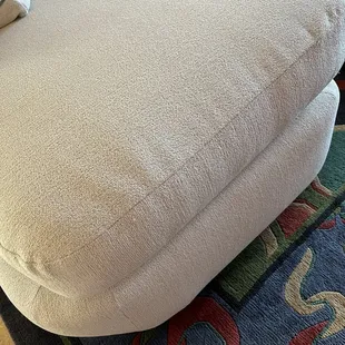 The uneven, buckled stitching on all pieces.