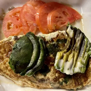 Rotten avocado, burned egg omelet.  Inedible.