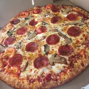 A well done Pepperoni and Mushroom fresh out of the oven.