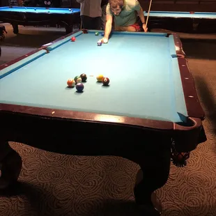 two people playing pool