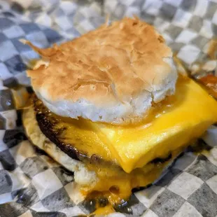 a cheeseburger with a biscuit