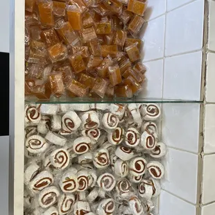 a variety of sweets in a display case