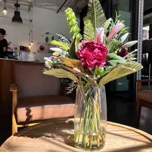 a vase of flowers on a table