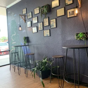 a bar with stools and tables