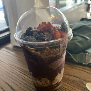 a dessert in a plastic cup