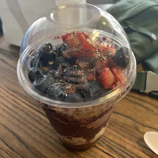 a dessert in a plastic cup
