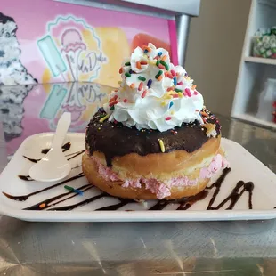 Donut sundae with strawberry ice cream.