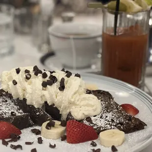 Chocolate Sourdough French Toast with bananas, strawberries and whipped cream