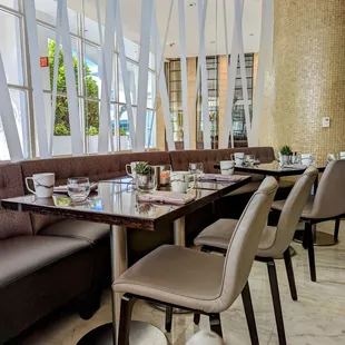 a restaurant with a long table and chairs