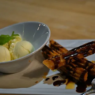 Churros and Ice Cream, Mexican vanilla bean ice cream, caramel sauce drizzled on churros...with a bit of almond brittle.  IG: @kim.d.west