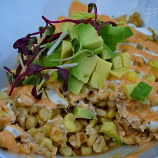 Esquite. roasted corn off the cobb, chipotle sauce, lime crema, cilantro, diced avocado cotija cheese IG: @kim.d.west