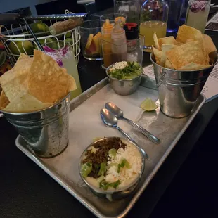 Chips, Queso Dip with gringo meat, and guacamole