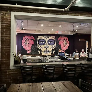 Patio bar looks inside with beautiful wall mural