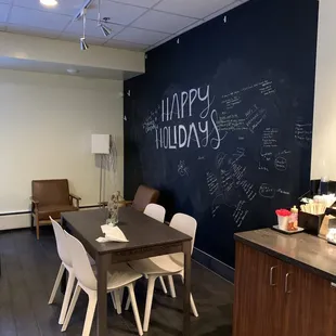 a room with a table and chairs