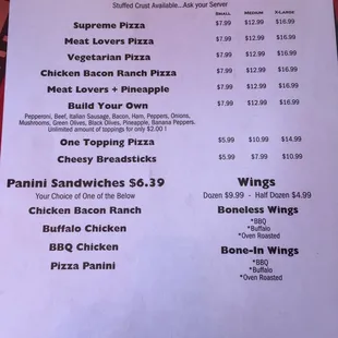 a menu for pizza and wings