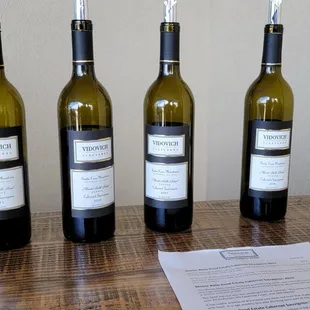 three bottles of wine on a table