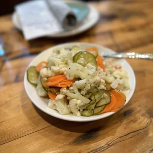 a plate of food on a wooden table