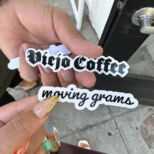 a person holding a cup of coffee