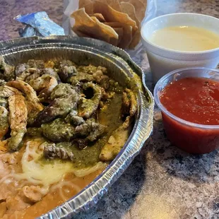 DoorDash Chile Verde.  Their version is beef and chicken.  Precut fajita meat.  Green nor red salsa had any merit.  Cheese dip sux