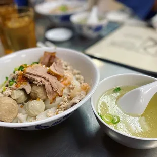 a bowl of soup and a bowl of rice