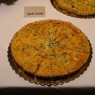 two quiche pies on a table