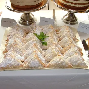 a variety of desserts displayed on a table
