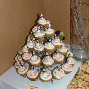 a display of cupcakes and cookies