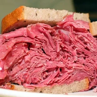 a plate of pastrami sandwich