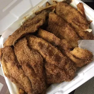 Tilapia on a bed of fries