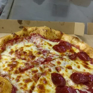 a pepperoni pizza in a box