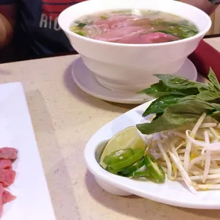 Pho with meat on the side. It usually comes inside the pho already, but we asked for it on the side