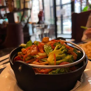 a bowl of stir fried vegetables
